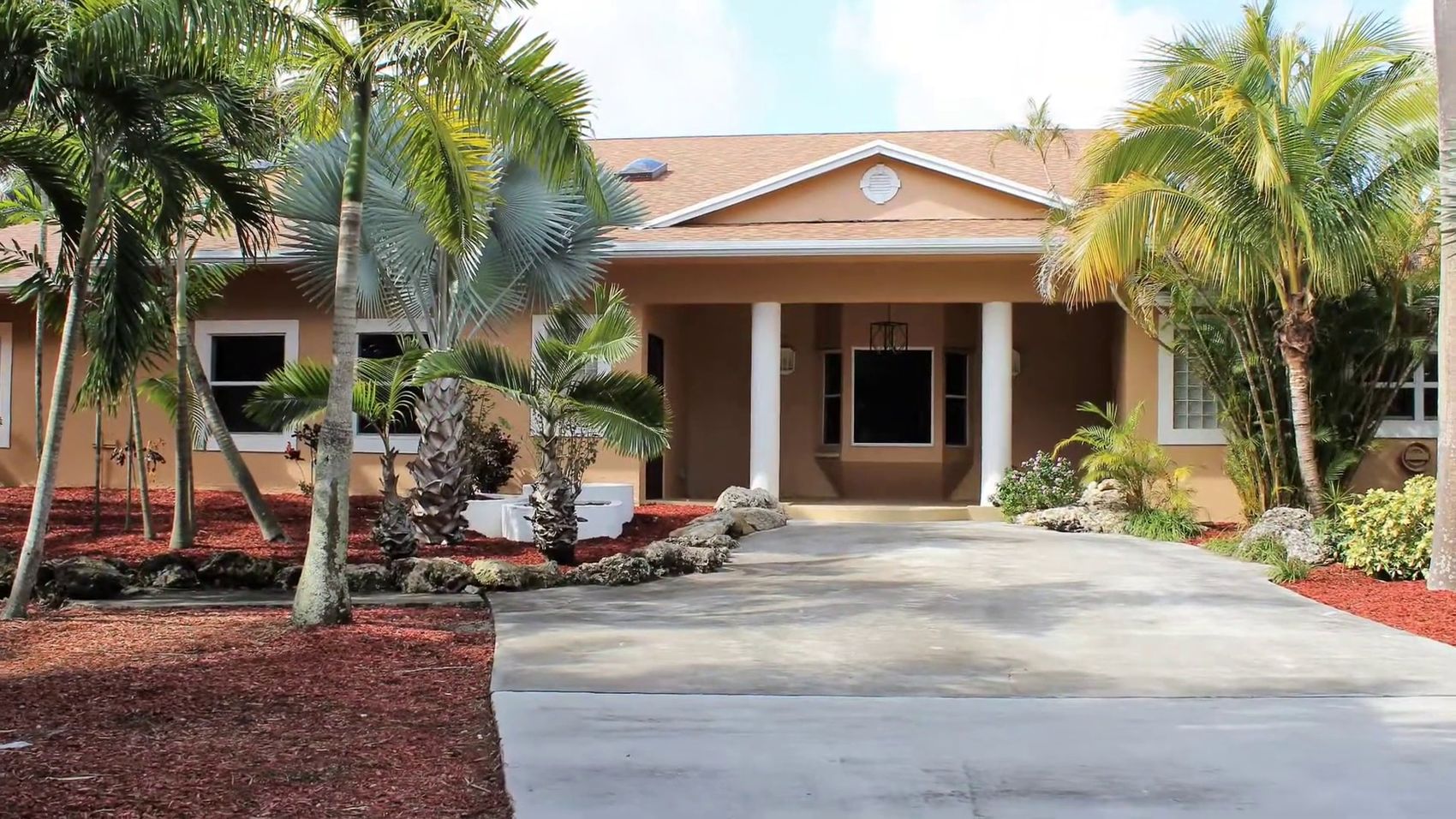 Estate entrance and drive from low altitude